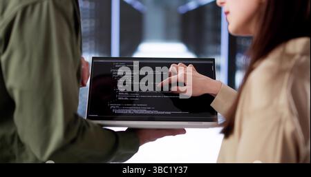 Smiling Latino Engineer Working On AI Technology In Data Center Stock Photo