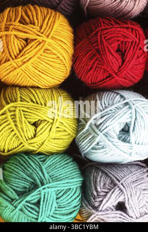 Various colors threads on rows in the store Stock Photo