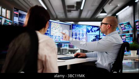Analyzing Financial Data. A Group Of People Work Together. Stock Photo