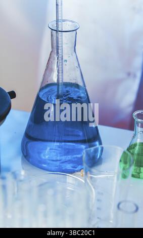 Scientist shows a diffusion in the flask Stock Photo
