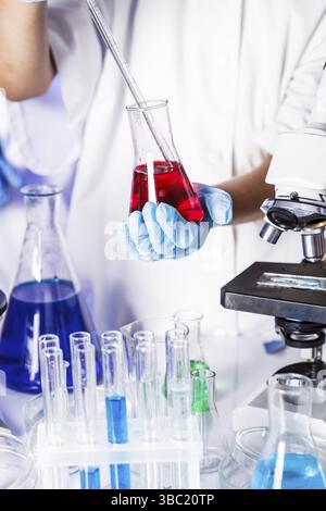 Scientist shows a diffusion in the Petri dish Stock Photo