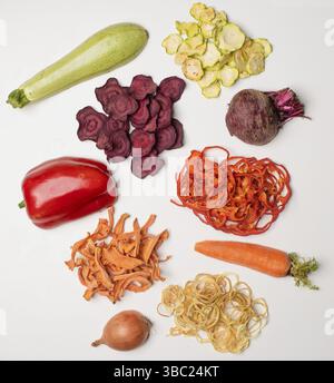 Sliced dried and fresh vegetables. The various tasty vegetables isolated on white background Stock Photo