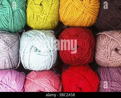 Various colors threads on rows in the store Stock Photo