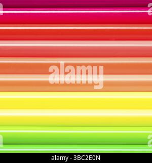 Set of colored pencils folded horizontally as a background. Colored pencils in neon colors Stock Photo