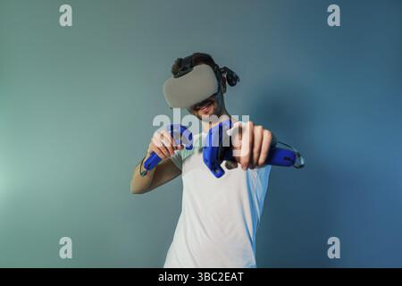 Man using a gaming gadget for virtual reality. Augmented reality in gaming Stock Photo