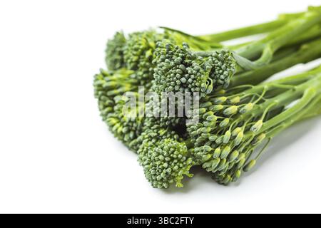 Raw broccolini heap close up isolated on white background Stock Photo