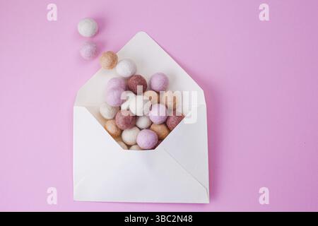 Paper Ball Message Colorful handmade felt balls fly out of paper envelope. Message, mail ...