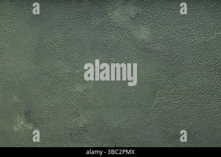 Green Textured Background with Rough Decorative Plaster Wall Surface Stock Photo