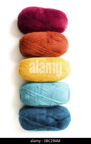 Multicolored threads of different trendy colors that arranged vertically in a row isolated on the white background Stock Photo