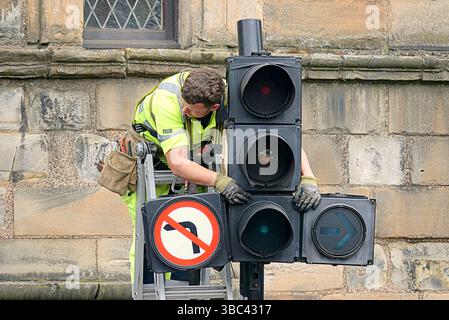 Glasgow, Scotland, UK. 18th May, 2025.  Workman were seen repairing traffic lights and bus shelters remained dismantled as normality returned to the trongate at glasgow cross. After Celtic championship trongate title party saw thousands of fans take over the traditional site in the city centre for the celebation. Fireworks, smokebombs, a police helicopter, hundreds of cops and the bus stops were dismantled for safety as fans used them last year for trampolines. Credit Gerard Ferry /Ģ����ý Live News Stock Photo