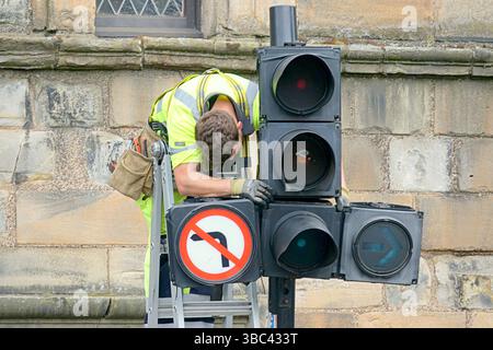 Glasgow, Scotland, UK. 18th May, 2025.  Workman were seen repairing traffic lights and bus shelters remained dismantled as normality returned to the trongate at glasgow cross. After Celtic championship trongate title party saw thousands of fans take over the traditional site in the city centre for the celebation. Fireworks, smokebombs, a police helicopter, hundreds of cops and the bus stops were dismantled for safety as fans used them last year for trampolines. Credit Gerard Ferry /Ģ����ý Live News Stock Photo