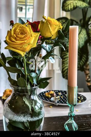 Still life with roses and candles Stock Photo