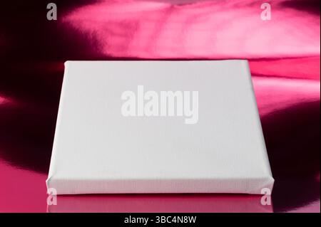 White rectangle podium on pink reflective background Stock Photo