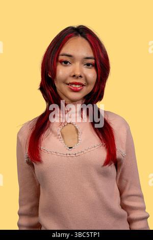 Stylish woman with vibrant red hair striking a pose for a camera Stock ...
