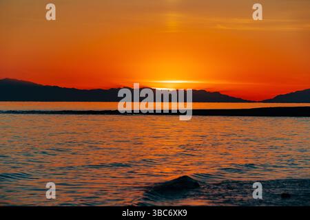 Fiery red sunset over lake Stock Photo