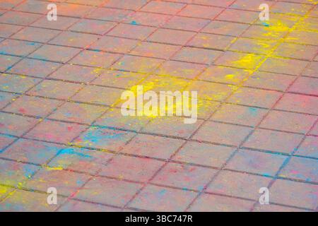 Multi-colored earth, paving slabs, powder coated with dry colors at the Holi festival Stock Photo