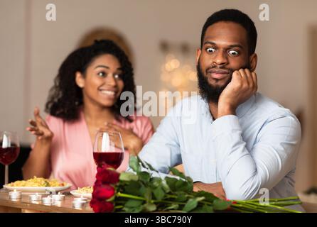 Black Man On Unsuccessful First Date In Restaurant Stock Photo