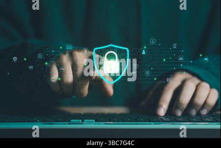 Cybersecurity lock key access and encryption secure access to user's personal information. A businessman using his mobile selects the security icon on Stock Photo