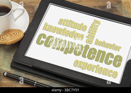 Competence concept - word abstract on a digital tablet with a cup of espresso coffee Stock Photo
