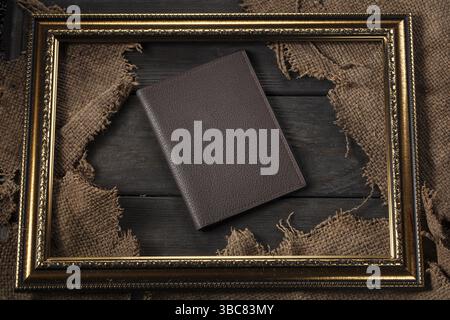 Leather wallet on a wooden table Stock Photo