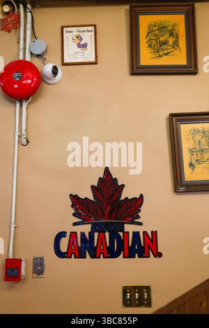 A vintage Molson Canadian sign & fire alarm at Commodore Bowling & Billiards along Granville Street in downtown Vancouver, BC. Stock Photo