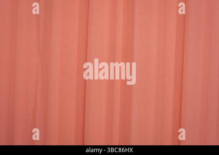 Salmon color crepe paper - background with crinkled texture Stock Photo