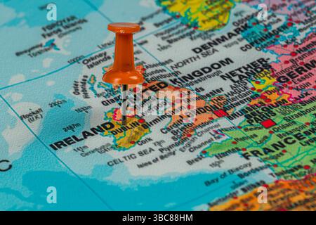 A bright orange pin marks the location of Dublin on a detailed map of Ireland, showcasing its geographic position among surrounding regions and landma Stock Photo