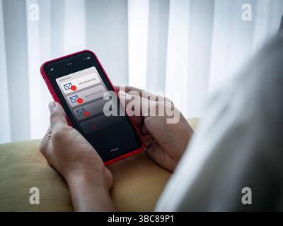 SMS spam and fake text message phishing concept. System hacked warning alert, email hack, scam malware spreading virus alert, notification on mobile p Stock Photo