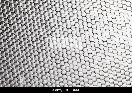 Black, metal honeycomb grid on white abstract background Stock Photo