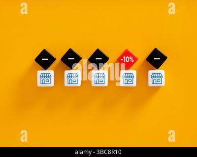 Store offer showing ten percent discount on yellow background with white and black dice. Finding the cheapest, most economical and affordable price of Stock Photo