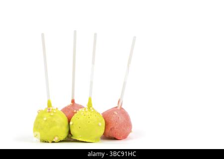 Sweets on a stick. Multicoloured cakes on a white background. Cake pops Stock Photo