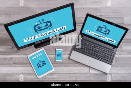 Self-driving car concept shown on different information technology devices Stock Photo