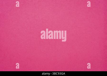 Background and texture of hot pink handmade Indian paper created from recycled cotton fabric Stock Photo