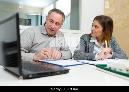 two architects designers discussing at office Stock Photo