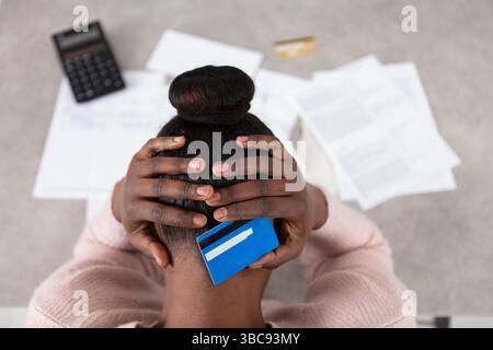 stressed miserable woman hold head in hands Stock Photo