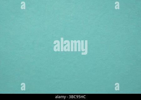 Background and texture of teal blue handmade Indian paper created from recycled cotton fabric Stock Photo