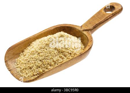 Golden flax meal on a rustic wooden scoop, isolated on white Stock Photo
