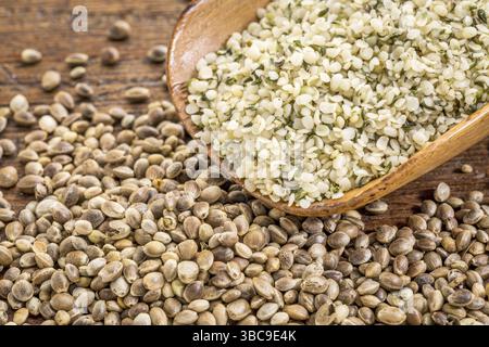 Hemp seeds and hearts in a rustic wooden scoop Stock Photo
