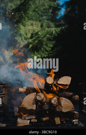 Close up image of fire burning outdoors on a sunny day Stock Photo
