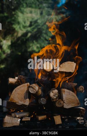 Close up image of fire burning outdoors on a sunny day Stock Photo