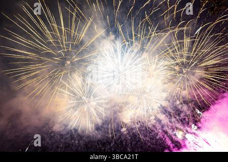Brightly colorful fireworks in the night sky Stock Photo