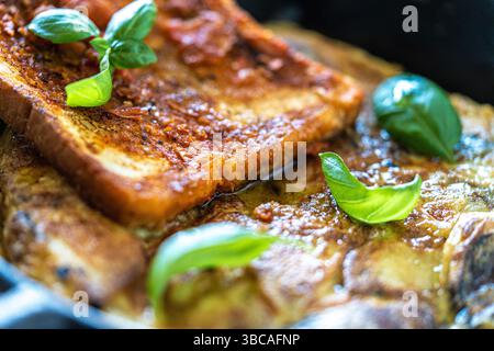 Traditional Spanish breakfast potato Tortilla and tostado pan con tomate. Potatoes and croutons with garlic and tomato sauce. Close-up. High quality p Stock Photo