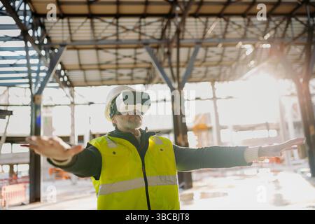 Engineer using virtual reality to inspect building progress. Stock Photo