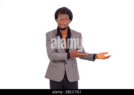 handsome young business man wearing elegant suit and pointing both hands aside. Stock Photo