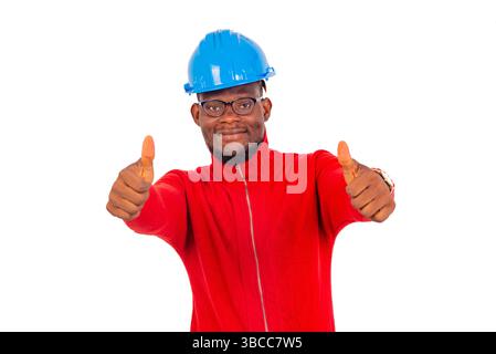engineer man wearing safety helmet standing over white background showing gesture of approval and looking at camera smiling. Stock Photo