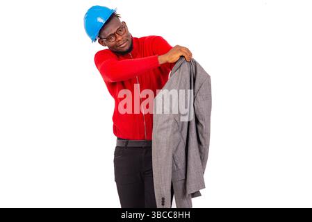 young business man construction engineer wearing a blue hard hat and wearing a jacket. Stock Photo