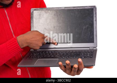 close up of male hand pointing index finger at laptop. Stock Photo