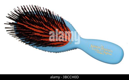 blue hair brush photographed on a white background Stock Photo