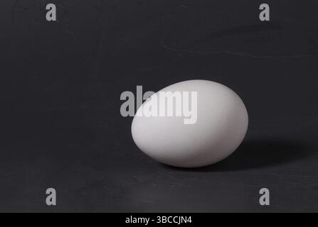 Chicken egg white single on a dark background. Stock Photo