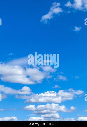 A beautiful blue sky with puffy white clouds. Stock Photo